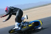 Crazy Photo Sequence: Racer Highsides a Motorcycle, Impersonates Superman